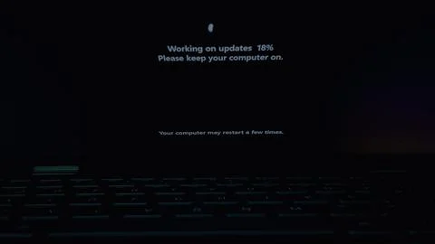 The Words Working on Updates being shown in the PC Screen Stock-Fotos