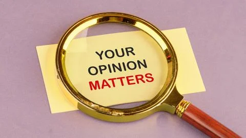 The words YOUR FEEDBACK MATTERS through a magnifying glass on a yellow leaf.. 写真素材