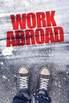 Work abroad title on the pavement Stock Photos
