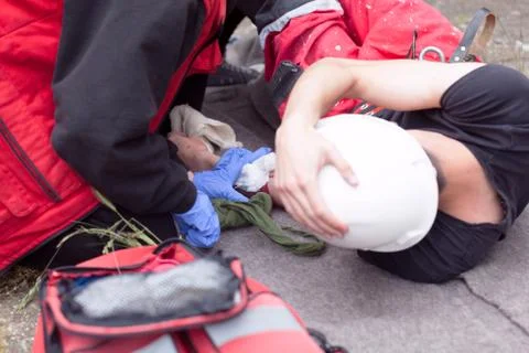 Work accident. First aid training. Arm injury. Stock Photos