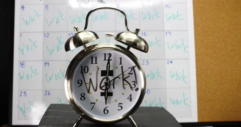 Work alarm clock dual silver bells with calendar work written on clock Stock Footage 206580886