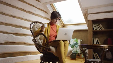 Work and coffee on attic Stock Footage 100316613