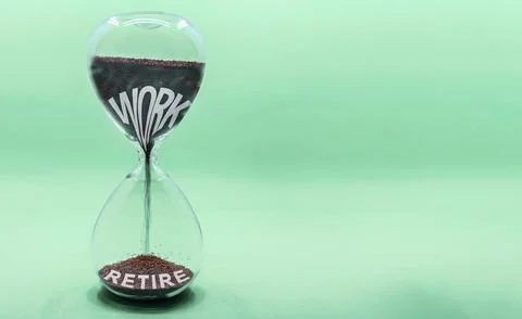 Work and retire words inside an hourglass. Suitable for concepts as countdown Stock Photos
