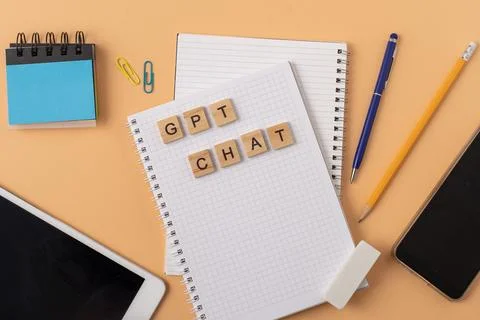 Work and study with the help of a chat bot. Words in wooden letters. Work table Stock Photos