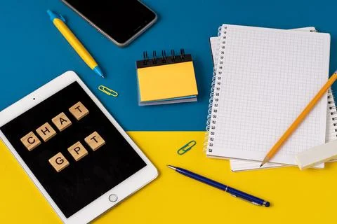 Work and study with the help of a chat bot. Words in wooden letters. Work table Stock Photos