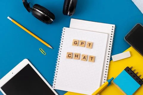 Work and study with the help of a chat bot. Words in wooden letters. Work table Stock Photos