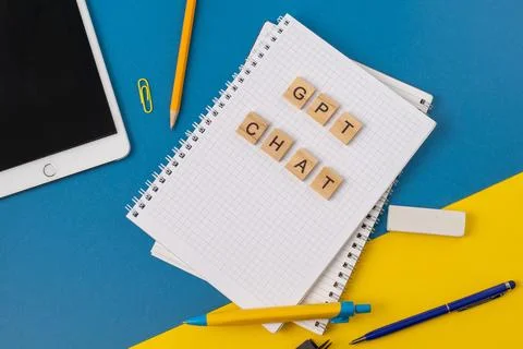 Work and study with the help of a chat bot. Words in wooden letters. Work table Stock Photos