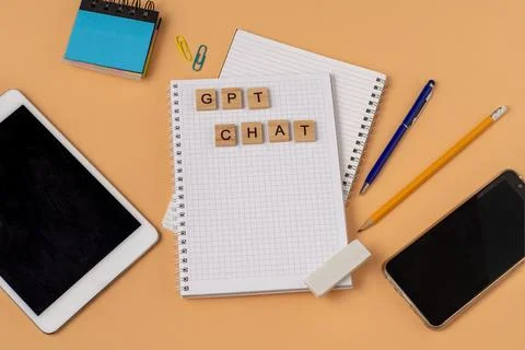 Work and study with the help of a chat bot. Words in wooden letters. Work table Stock Photos