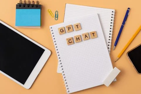 Work and study with the help of a chat bot. Words in wooden letters. Work table Stock Photos