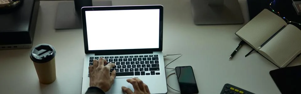 Work anytime. High angle view of hands of man sitting at the table in front of Foto stock