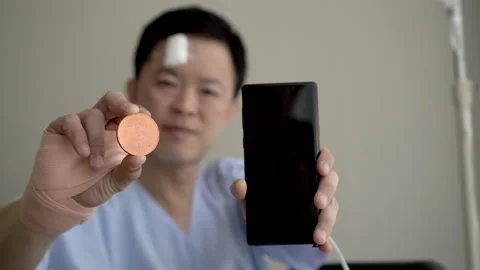 Work from anywhere trading cryto while injured in from hospital using smartph Stock Footage 170633771