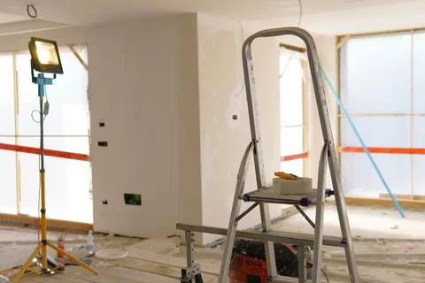 A work area prepared for drywall installation and painting 스톡 사진