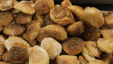 The work of a baker in a bakery, the production of bread. Fresh bread. Видео 240217609