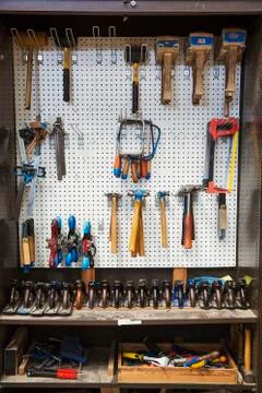 Work bench in a boat-builder's workshop, selection of hand tools for wood Stock Photos