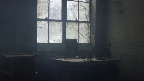 Work bench in front of industrial window in warehouse with random objects 스톡 동영상 104504918