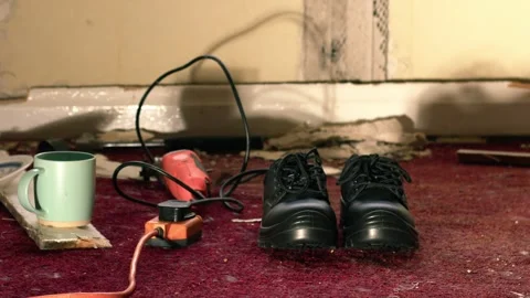 Work boots and tools in house under renovation Stock Footage 288345238