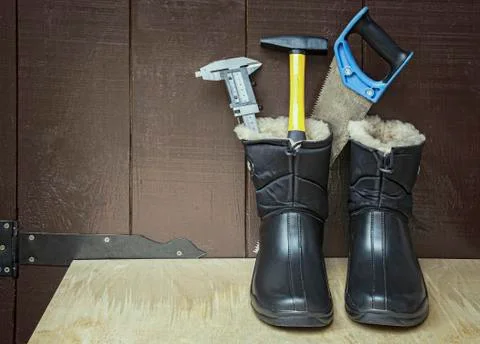 Work boots and tools. Stock Photos