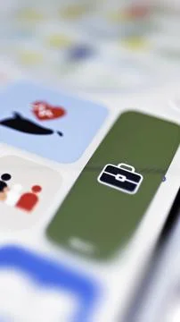Work briefcase displayed on green service tile Stock Photos