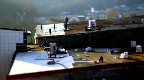 The work of builders. Laying tiles and roofing. Tilt shift. Time lapse Video stock 44057175