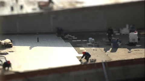 The work of builders. Laying tiles. Tilt shift. Time lapse Video stock 44056794