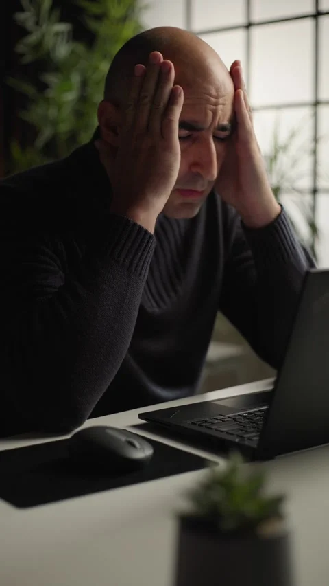 Work burnout and mental stress, man feeling overwhelmed while working on laptop Stock Footage 344144539