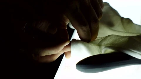 Work with bw film roll on the light table Stock Footage 70792009