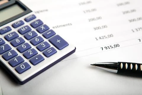 Work on the calculator and papers Stock Photos