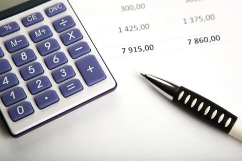 Work on the calculator and papers Stock-Fotos