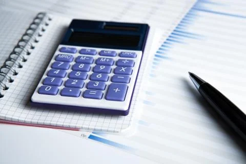 Work on the calculator and papers Stock Photos