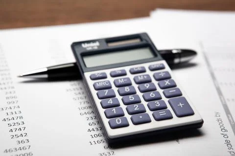 Work on the calculator and papers Stock Photos