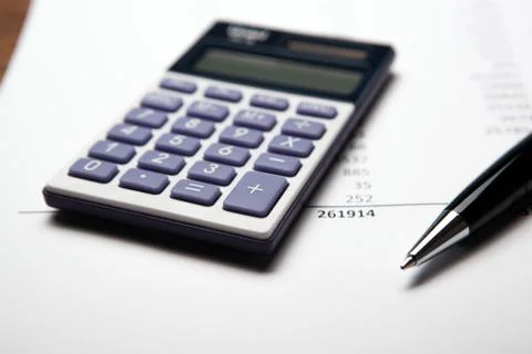 Work on the calculator and papers Stock Photos