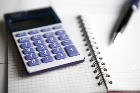 Work on the calculator and papers Stock Photos