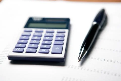 Work on the calculator and papers Stock Photos