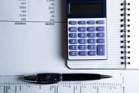 Work on the calculator and papers Stock Photos