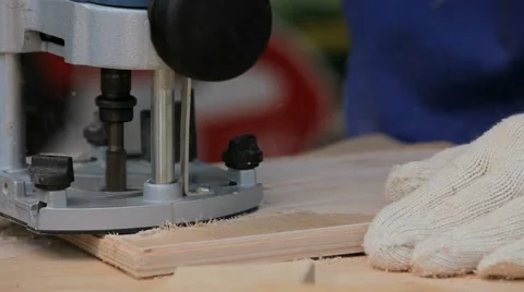 Work Carpenter With an Electric Hand-Milling Cutter Stock Footage 52272689