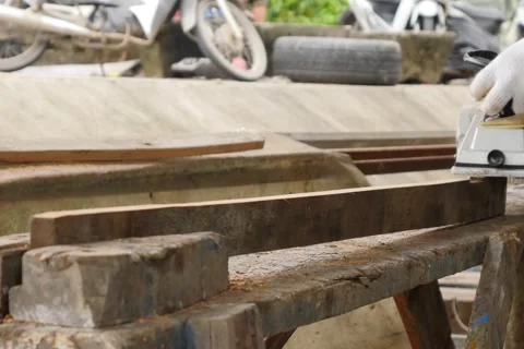 Work carpenter in the workshop. Electric Planer. Stock Footage 65007765
