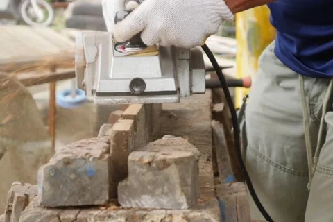 Work carpenter in the workshop. Electric Planer. Stock Footage 65007811