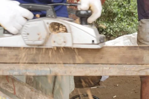 Work carpenter in the workshop. Electric Planer. Stock Footage 65007870