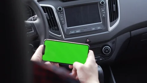 Work on cell phone, sit in car, loking road on map in network, travel app Stock Footage 115894572