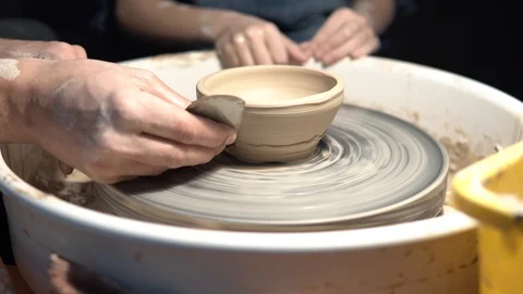 Work with clay on a potter's wheel Stock Footage 89979059
