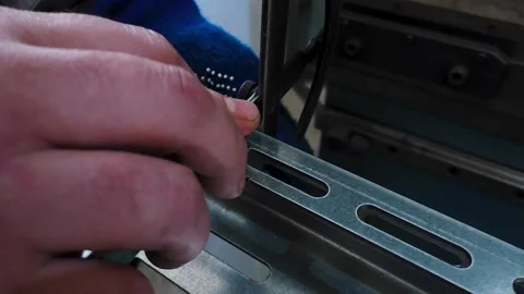 Work on a CNC bending machine in a factory. Stock Footage 239984291