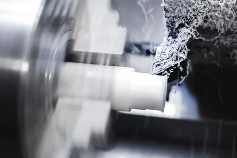 The work of a CNC lathe on a workpiece made of textolite or propylene Stock Photos