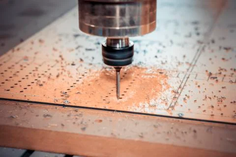 Work on a CNC machine. Presence of a pause function for chip removal. Stock Photos
