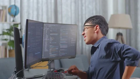 Work with code (133)Asian Boy Programmer Having A Backache While Creating Stock Footage 233462375