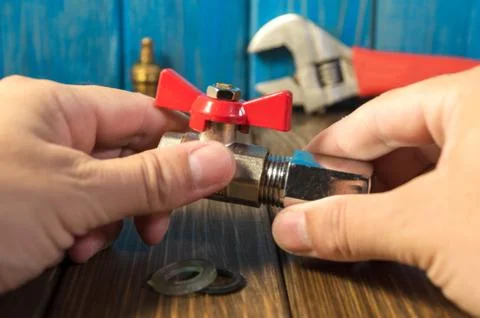 Work combines elements of plumbing with the help of tools. Stock Photos