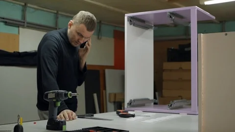 The work communicates with the client by phone Stock-Footage 88258196