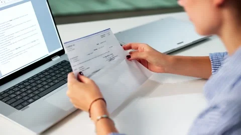 Work Compensation: Holding Payroll Check Envelope Stock Footage 314522713