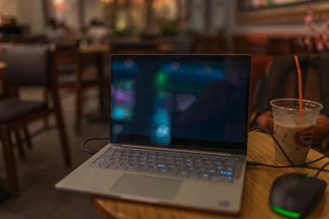 Work on a computer in a cafe. Freelancing in a coffee shop. Stock Photos