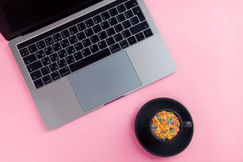 Work computer on a pink background top view. Flat lay. Minimal concept. Stock Photos