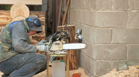 Work conducts prevention chainsaw. Man disassemble and clean the tool. moving Stock Footage 69069439